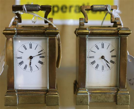 Pair of miniature brass carriage timepieces